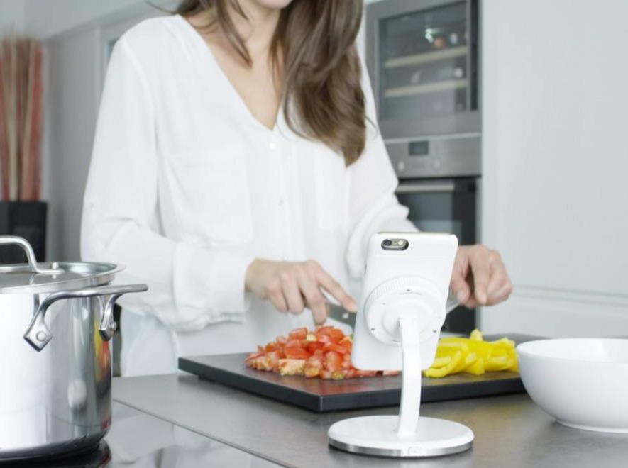 a woman is preparing a meal in a kitchen 